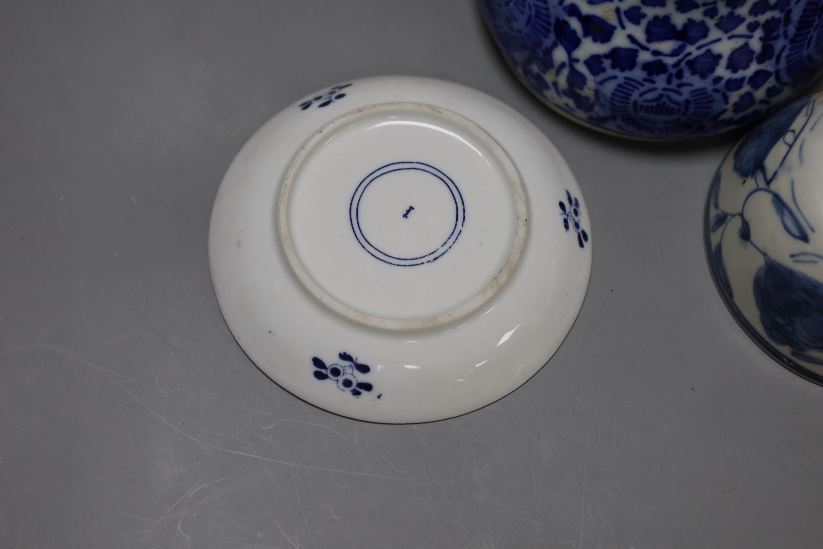 A collection of Chinese blue and white tea bowls, a vase, metal planter and book on Hong Kong by John and Veronica Stericker, (7)